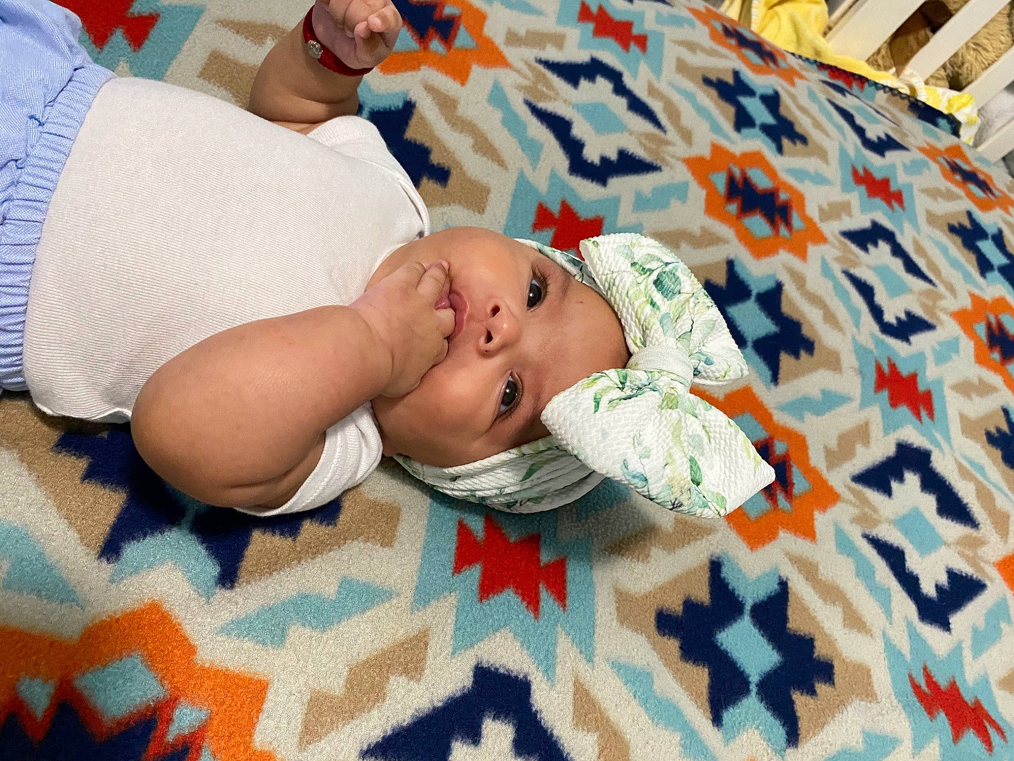 Mariah joined the competition — help win amazing prizes! baby, baby_products, baby_sleeping, baby_toddler_clothing, bedding, bedtime, child, comfort, flooring, grass, happy, hat, headwear, leisure, linens, pattern, person, room, skin, textile