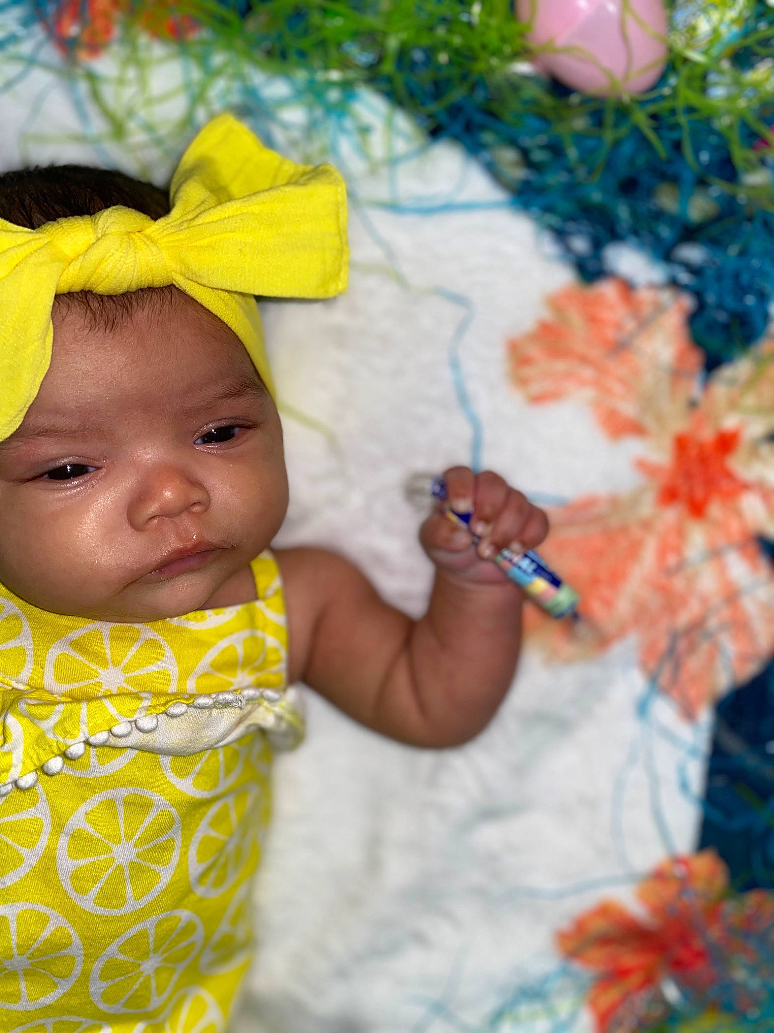 Mariah is registered to the contest to win money with this photo: baby, baby_products, baby_toddler_clothing, child, event, facial_expression, fun, grass, happy, headwear, leisure, orange, pattern, people_in_nature, person, photograph, plant, skin, summer, textile