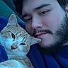 Dababy joined the competition — help win amazing prizes! man, cat, indoor, selfie, snuggling, orange_cat, white_cat, beard, blue_clothing, portrait, pet, animal, face, feline, cozy, relaxed, closeup, home, comfort, affection