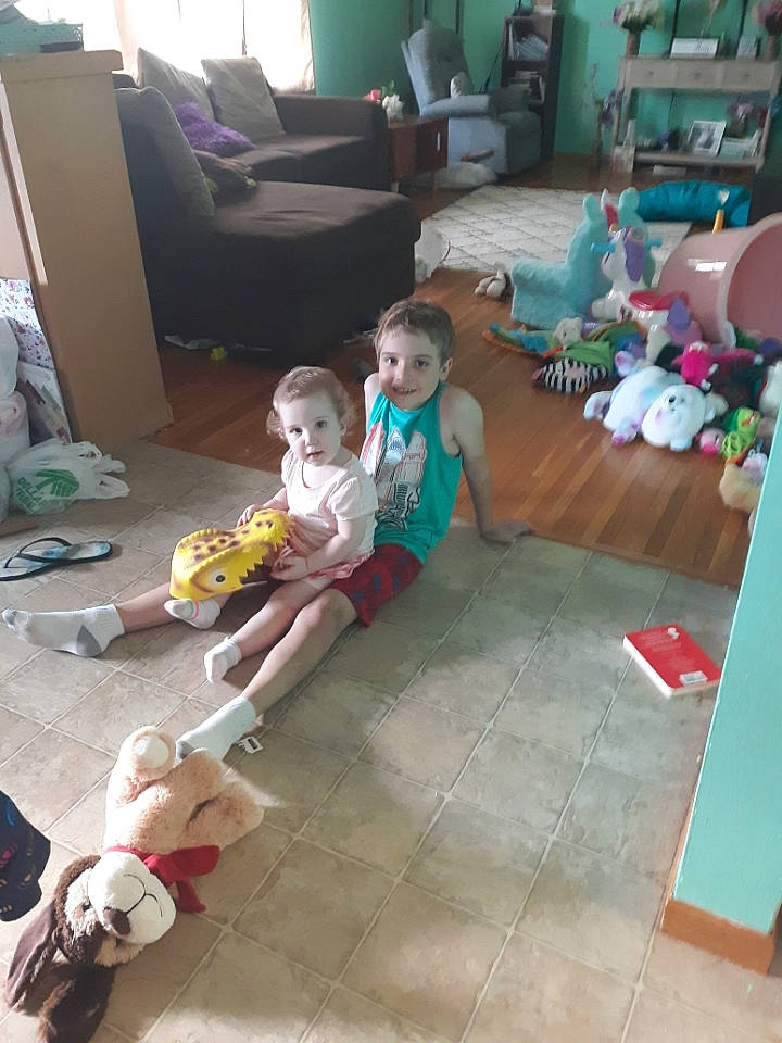 Kurt joined the competition — help win amazing prizes! child, comfort, couch, event, floor, flooring, foot, fun, hardwood, holiday, joy, lap, leisure, living_room, person, play, room, sandal, sitting, toddler