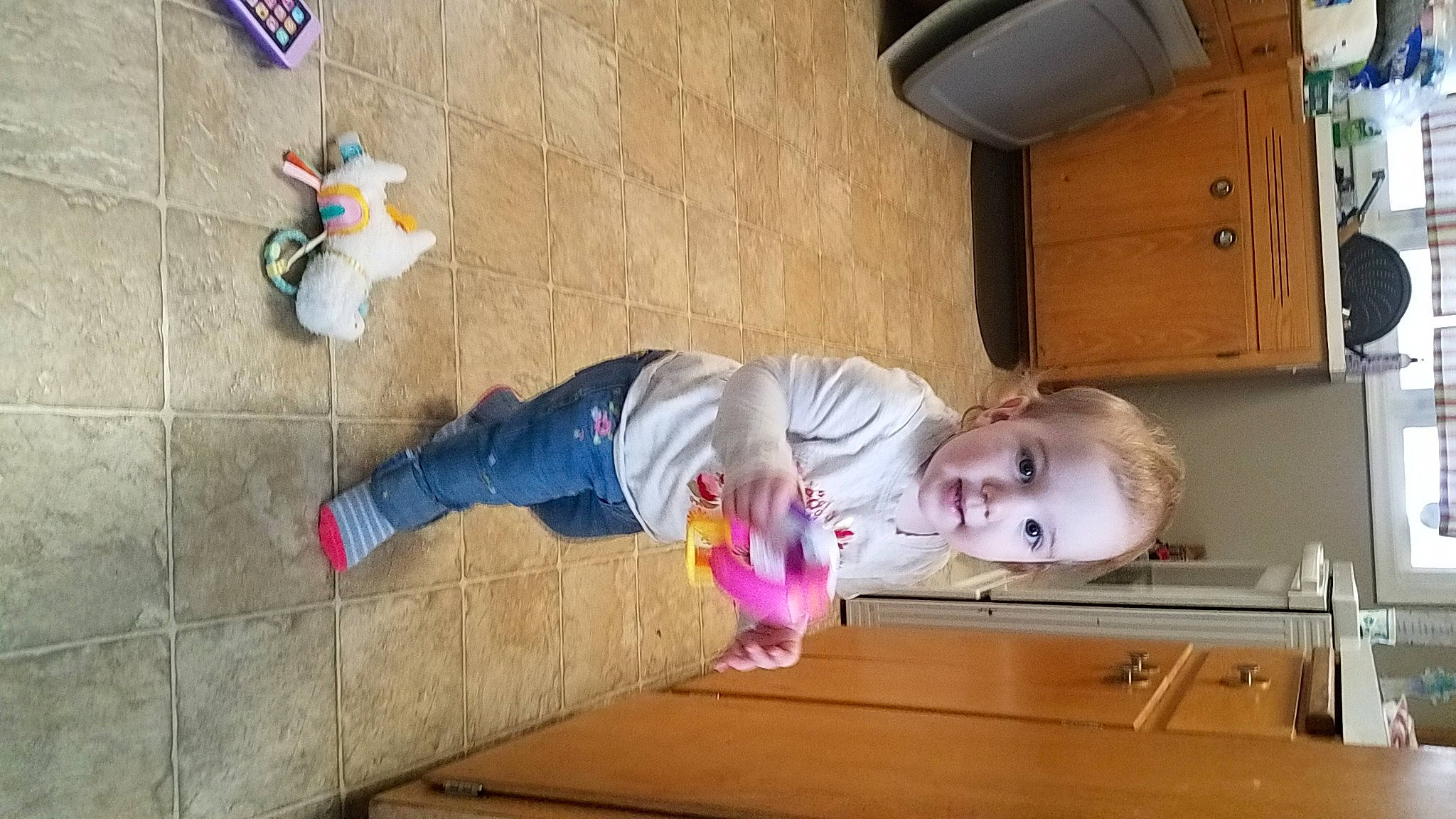 Chloe joined the competition — help win amazing prizes! baby, baby_toddler_clothing, cabinetry, child, clothing, drawer, floor, flooring, fun, hardwood, human_leg, leg, leisure, person, play, room, snapshot, stuffed_toy, toddler, toy