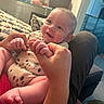Beau is registered to the contest to win money with this photo: baby, child, clothing, couch, cute, expression, face, foot, furniture, hands, happy, holding, home, indoor, infant, legs, person, playful, skin, smiling