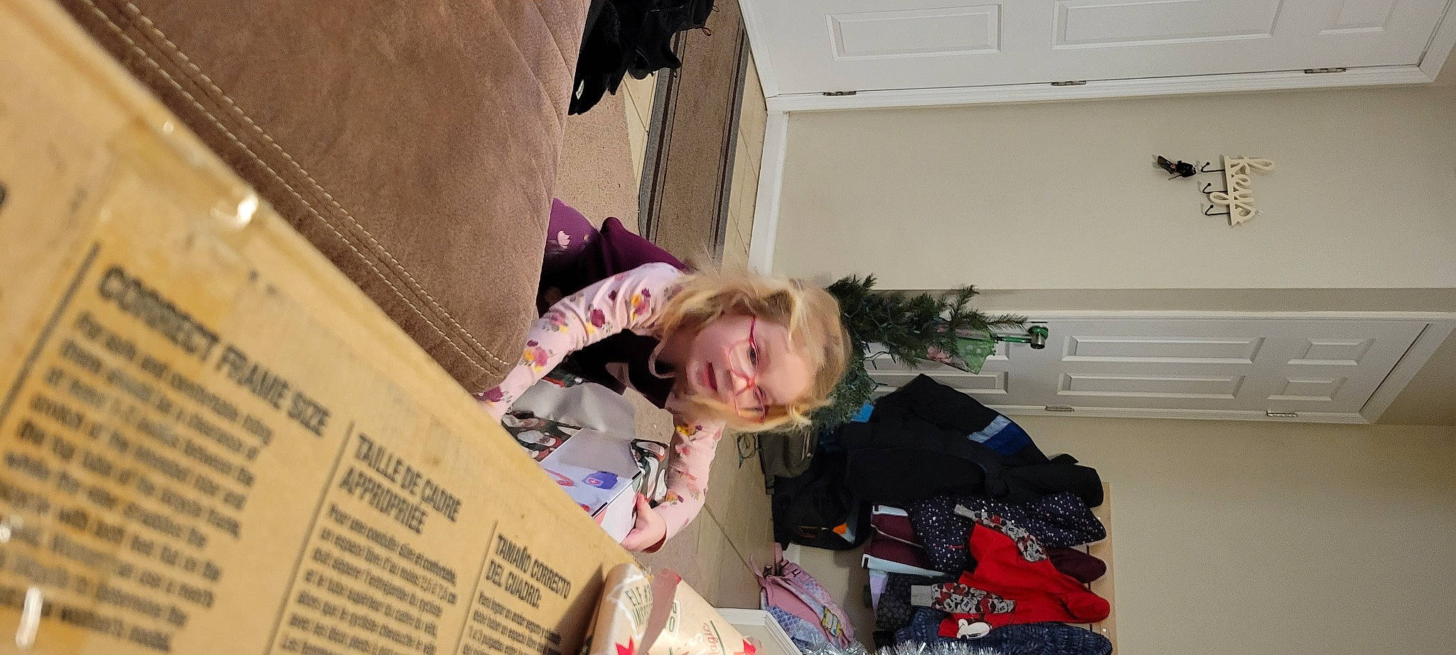 Charlotte joined the competition — help win amazing prizes! box, cardboard, child, event, fun, happy, packaging_and_labeling, person, room, shipping_box, sitting, smile, toddler, tree