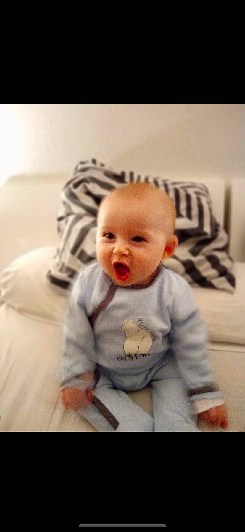 Maylon participe au concours pour gagner de l'argent avec cette photo : arm, baby, baby_toddler_clothing, cheek, clothing, comfort, flash_photography, floor, flooring, fun, happy, iris, linens, mouth, person, sitting, sleeve, smile, t_shirt, toddler