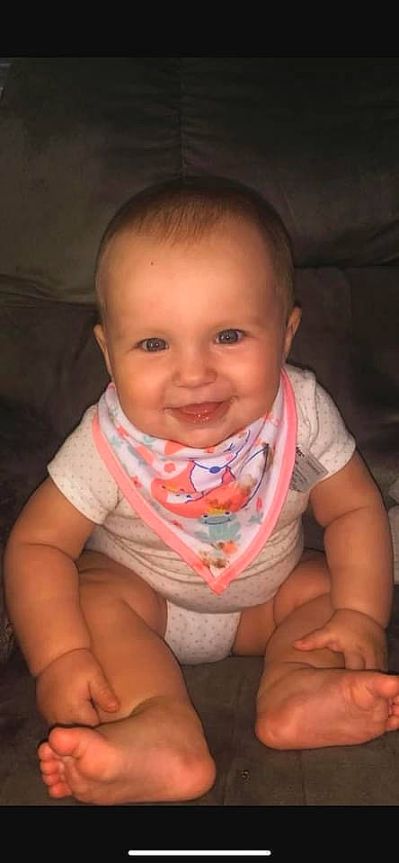 Averie is registered to the contest to win money with this photo: arm, baby, cheek, chin, eyebrow, finger, forehead, gesture, hand, happy, iris, joy, leg, lip, mouth, neck, nose, person, skin, smile