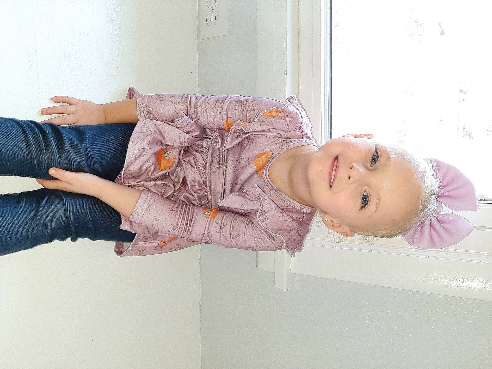 Kalli is registered to the contest to win money with this photo: clothing, comfort, couch, dress, elbow, facial_expression, happy, human_body, joint, joy, knee, leg, person, pink, purple, shoulder, skin, sleeve, smile, textile