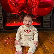Noah joined the competition — help win amazing prizes! baby, infant, child, red_balloons, heart_balloons, onesie, cupid_crew, fireplace, hardwood_floor, sitting, ribbon, toes, smile, face, portrait, indoor, cozy, valentines, reflection, cute