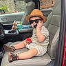 Noah joined the competition — help win amazing prizes! child, toddler, car, car_seat, sunglasses, straw_hat, toy_phone, toy, red_toy, striped_clothing, sandals, sitting, smiling, portrait, vehicle, interior, snacks, drink, urban, road_trip