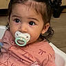 Angelina joined the competition — help win amazing prizes! toddler, child, baby, sitting, high_chair, pacifier, bottle, pink_clothing, hair_buns, dark_hair, face, eyes, indoors, portrait, close_up, hand, infant, home, curious, photography