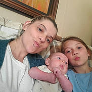 Lola joined the competition — help win amazing prizes! baby, blanket, casual, child, clothing, couch, face, family, happy, home, indoor, kiss_face, necklace, painting, people, playful, portrait, relaxed, skin, woman