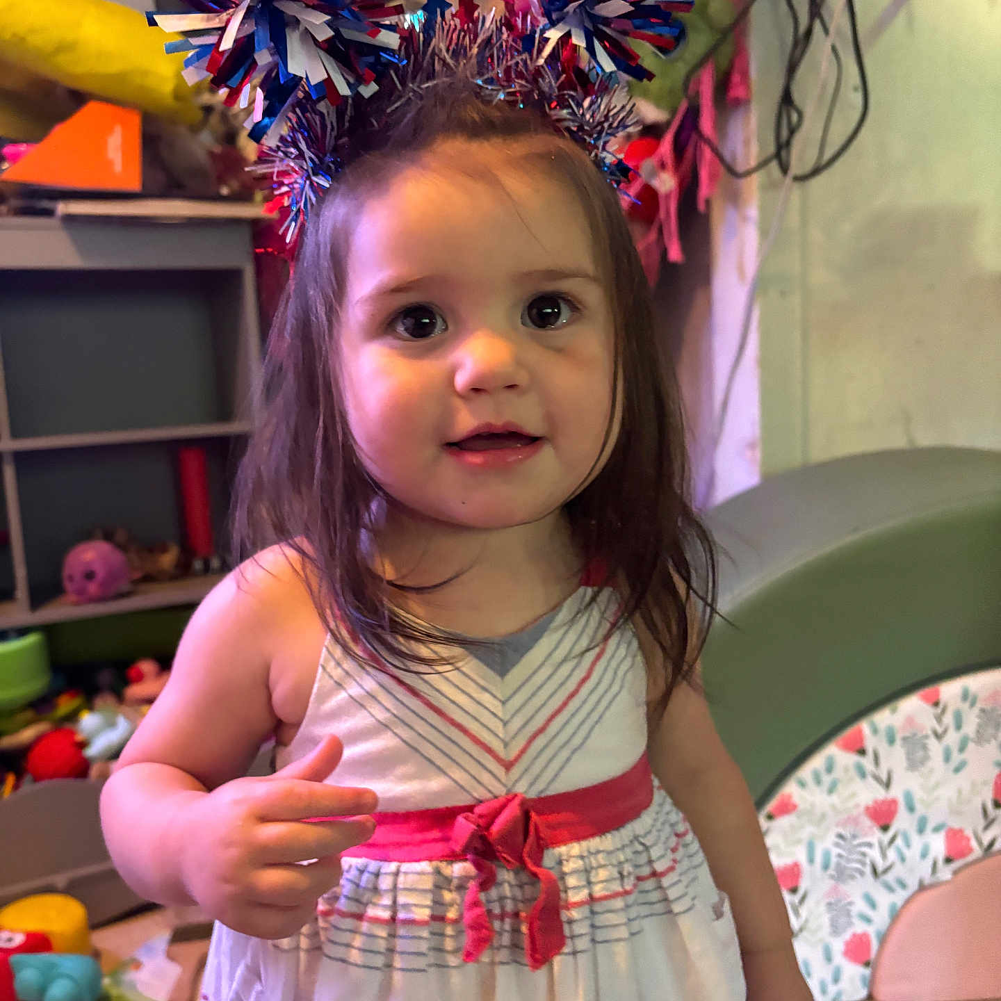Miyrah joined the competition — help win amazing prizes! casual, child, colorful, curly_hair, cute, decorations, dress, floor, furniture, happy, headband, indoor, person, playroom, pom_poms, portrait, smiling, toddler, toys, young_child