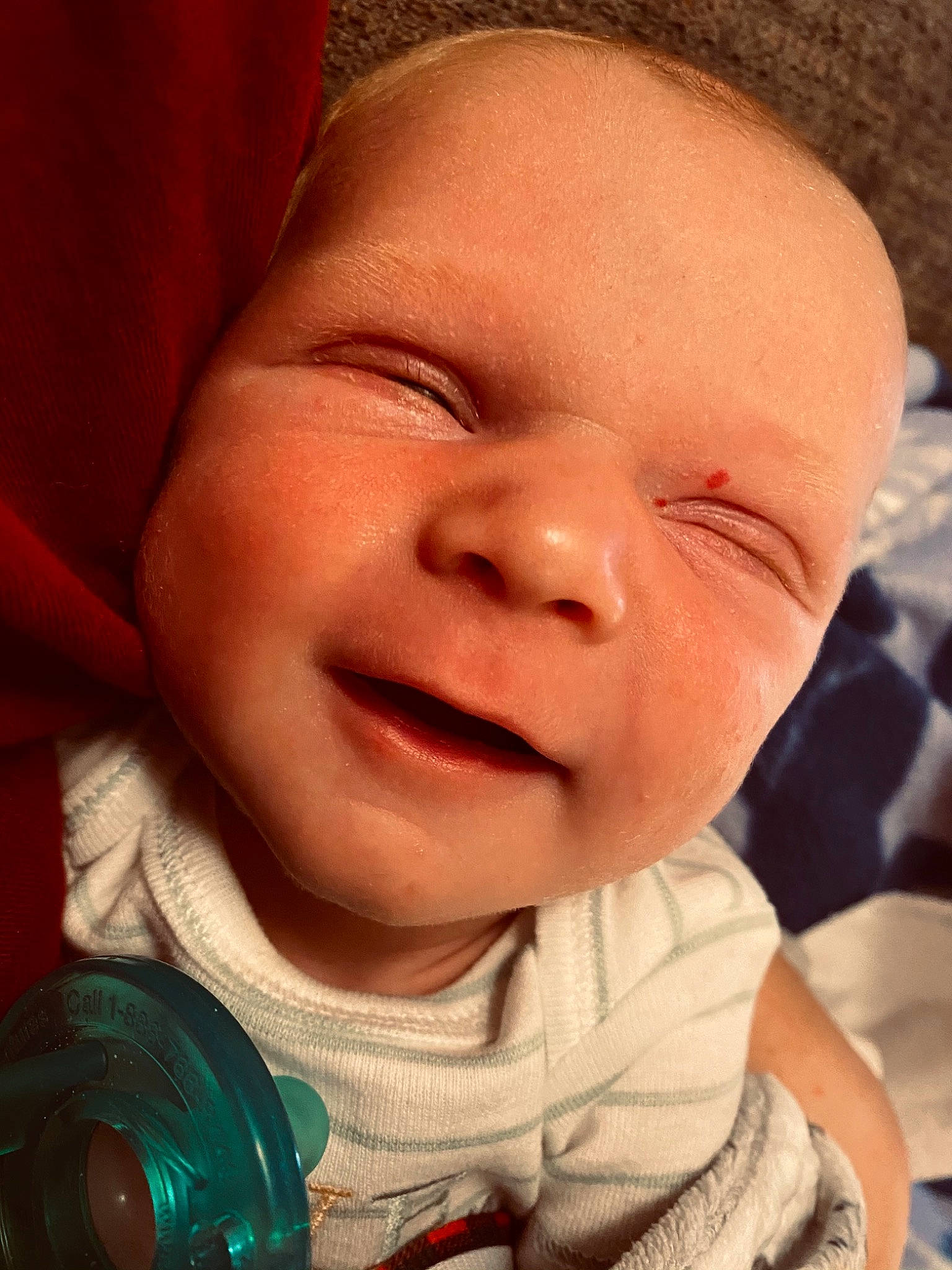 Shepherd is registered to the contest to win money with this photo: baby, baby_toddler_clothing, cheek, chin, eye, facial_expression, finger, forehead, happy, head, human_body, iris, lip, mouth, nose, person, pink, skin, sleeve, smile