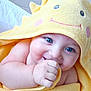 baby, blue_eyes, towel, yellow, hooded_towel, smiling, cute, chubby_cheeks, infant, skin, hand, face, closeup, portrait, soft_texture, playful, happy, indoors, child, wrapped