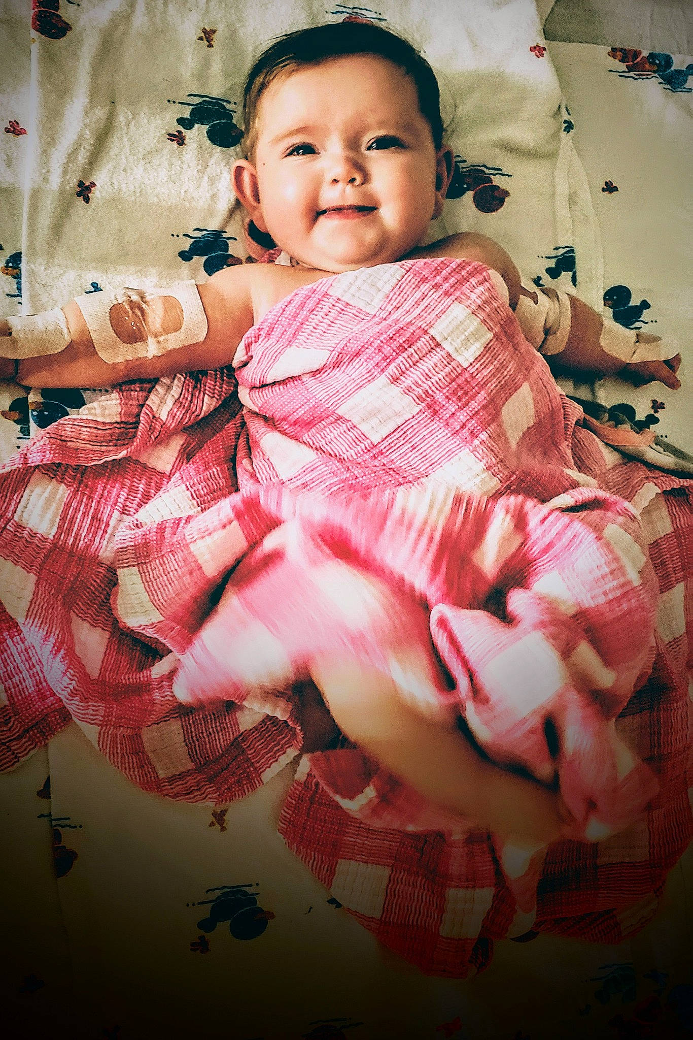 Quinn is registered to the contest to win money with this photo: baby, beauty, cheek, child, eye, face, happy, person, pink, skin, smile, textile, toddler