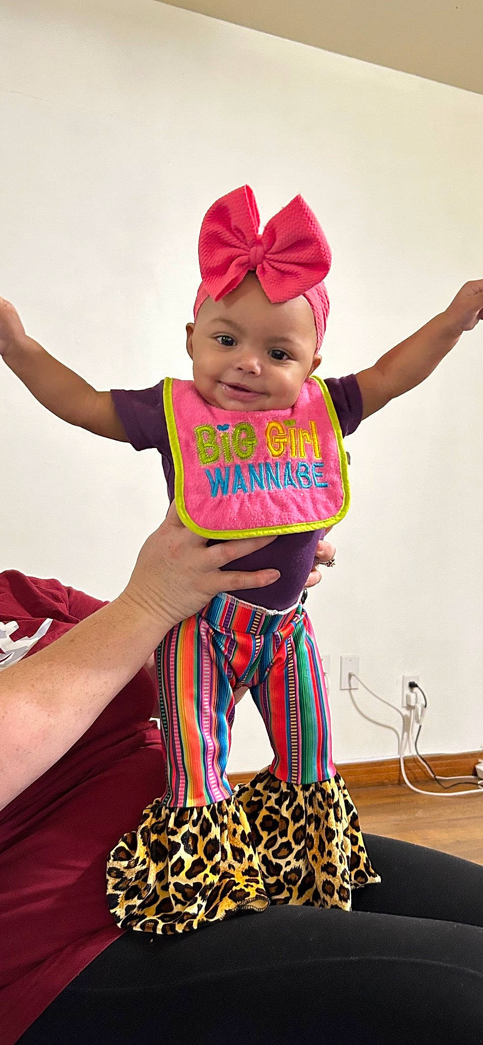 Aniyah is registered to the contest to win money with this photo: baby, baby_toddler_clothing, cap, electric_blue, event, fashion_accessory, fashion_design, happy, head, headwear, joy, magenta, pattern, person, personal_protective_equipment, pink, sleeve, smile, sportswear, thigh