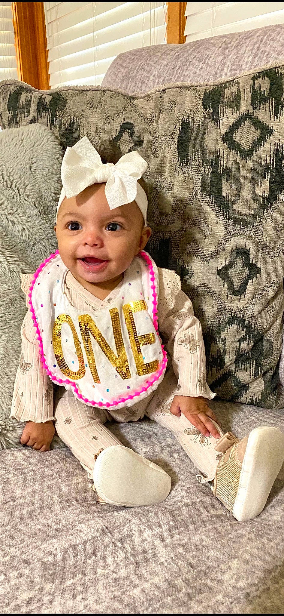 Aniyah joined the competition — help win amazing prizes! baby, baby_toddler_clothing, cap, child, costume_hat, fashion_accessory, font, fun, grass, happy, headgear, headpiece, headwear, pattern, people_in_nature, person, pink, sitting, skin, sleeve