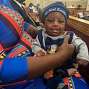 Emorii joined the competition — help win amazing prizes! baby, child, infant, easter, hat, bowtie, adult_hand, colorful_clothing, church, pew, man, suit, tie, glasses, people, seated, indoor, portrait, smiling, celebration