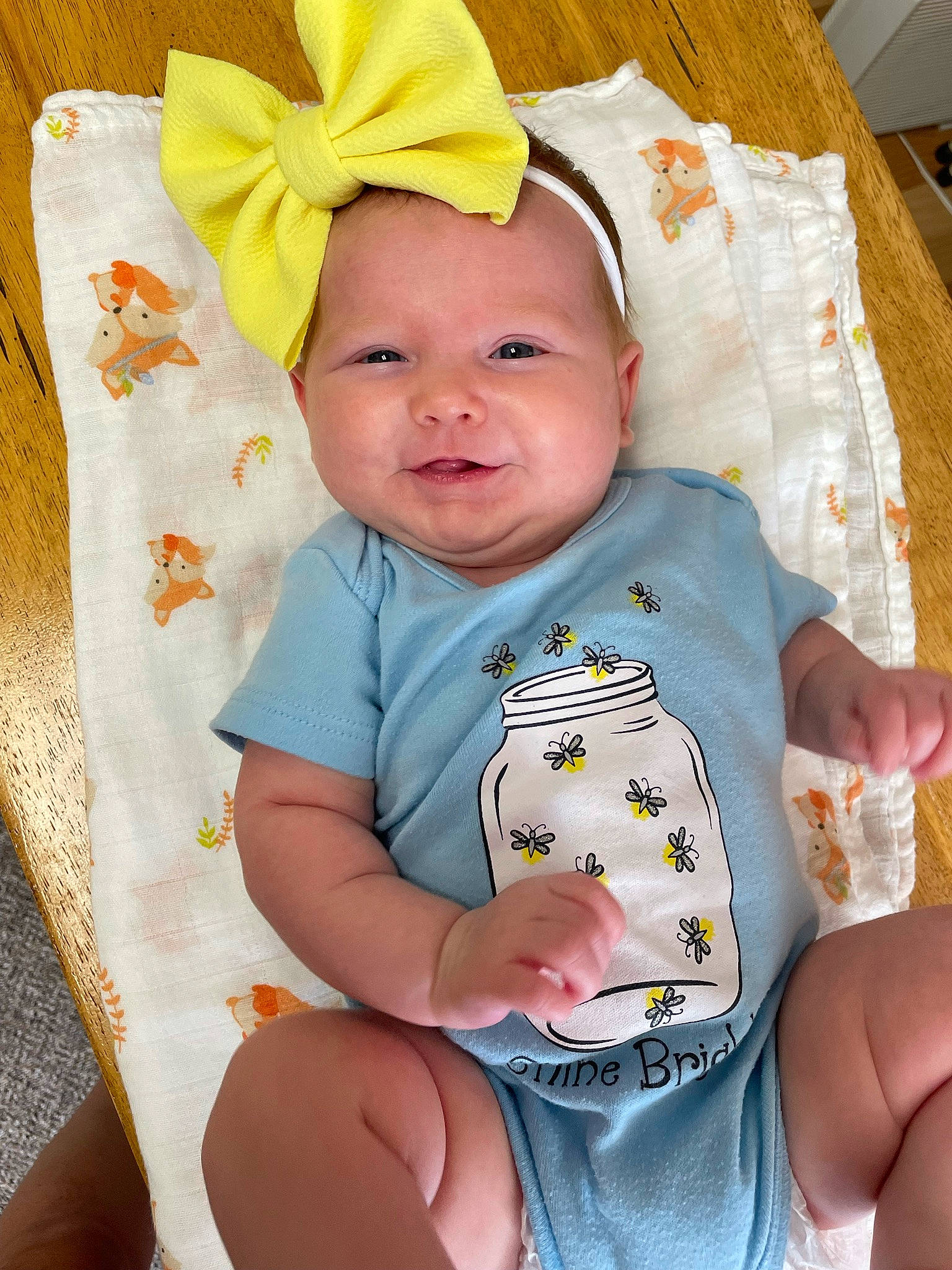 Huntley is registered to the contest to win money with this photo: baby, baby_products, baby_safety, baby_toddler_clothing, cheek, child, comfort, eye, face, facial_expression, finger, hand, happy, head, person, pink, skin, sleeve, smile, textile