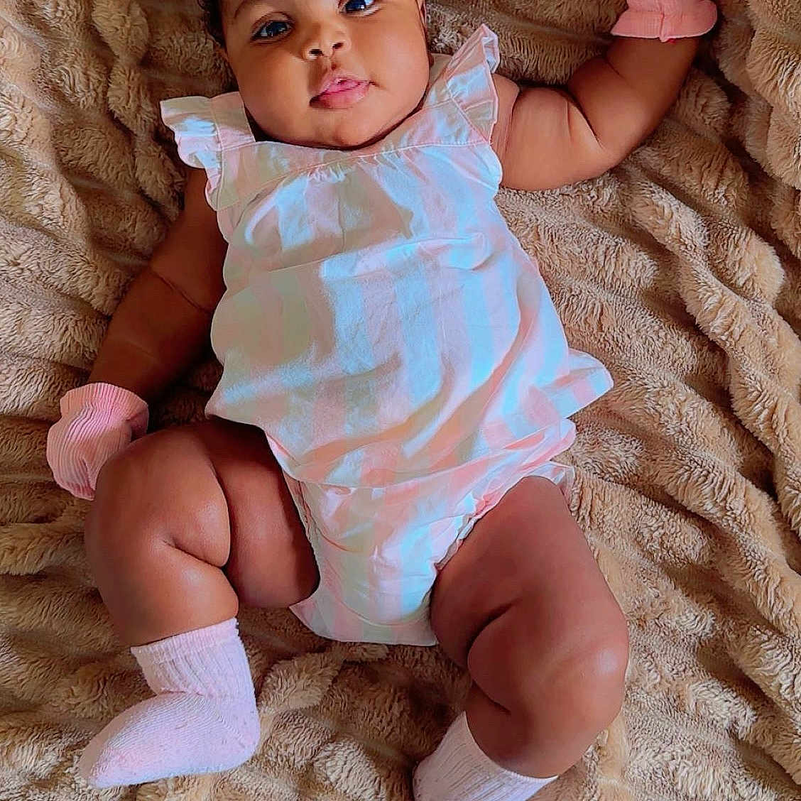 Sheneska joined the competition — help win amazing prizes! baby, blanket, child, comfortable, cute, expression, face, human, indoors, infant, laying_down, limbs, pastel_dress, pink_mittens, pink_socks, plush, portrait, relaxed, skin, soft_texture