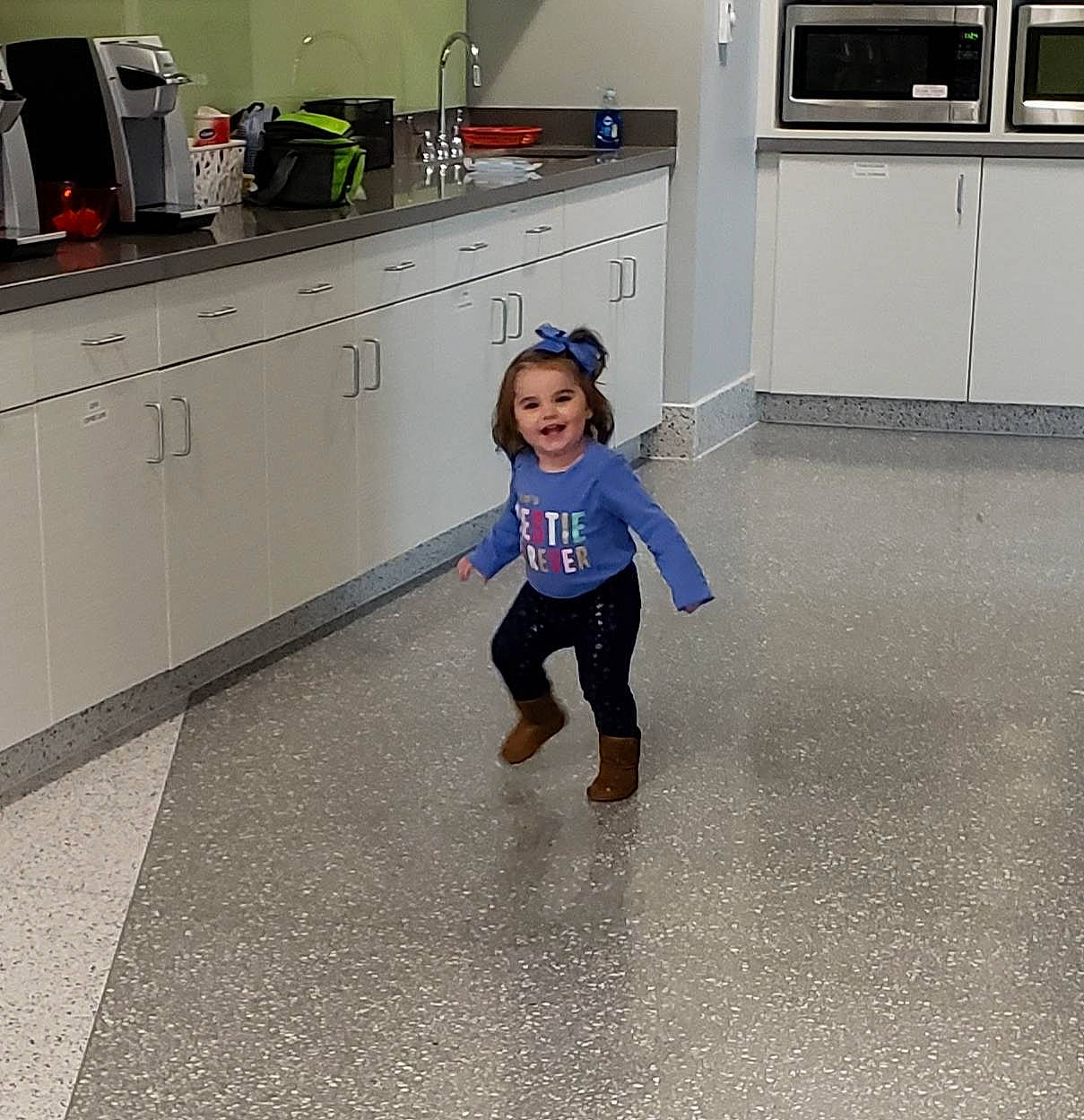 Laney is registered to the contest to win money with this photo: child, floor, flooring, joy, person, shoe, snapshot, standing, toddler