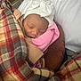Ember joined the competition — help win amazing prizes! baby, newborn, sleeping, blanket, plaid, hat, bow, cozy, warm, pink, brown, face, child, infant, soft, resting, indoors, comfort, peaceful, wrapped