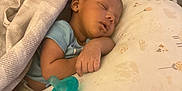 Ember is registered to the contest to win money with this photo: baby, newborn, sleeping, blanket, pillow, pacifier, infant, rest, peaceful, child, soft, indoors, cute, face, hand, clothing, comfort, bedroom, toddler, nap