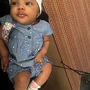 Ember is registered to the contest to win money with this photo: baby, child, infant, blue_dress, headband, socks, polka_dot, indoor, carpet, floor, person, cute, young_child, portrait, seated, furniture, home, skin, hand, footwear