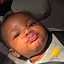 Ember is registered to the contest to win money with this photo: baby, child, car_seat, seatbelt, pouting, face, expression, indoor, infant, clothing, closeup, cute, person, young, head, skin, sitting, seat, child_seat, portrait