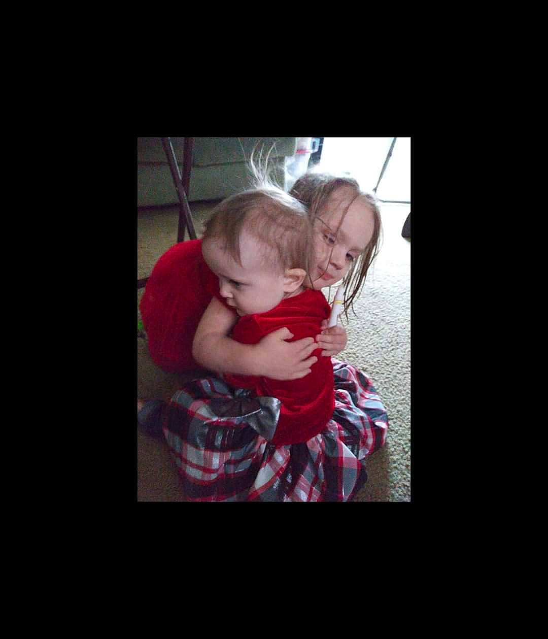 Amber joined the competition — help win amazing prizes! cheek, child, flesh, fun, hand, happy, hug, interaction, love, person, photo_caption, photography, red, sitting, smile, snapshot, toddler