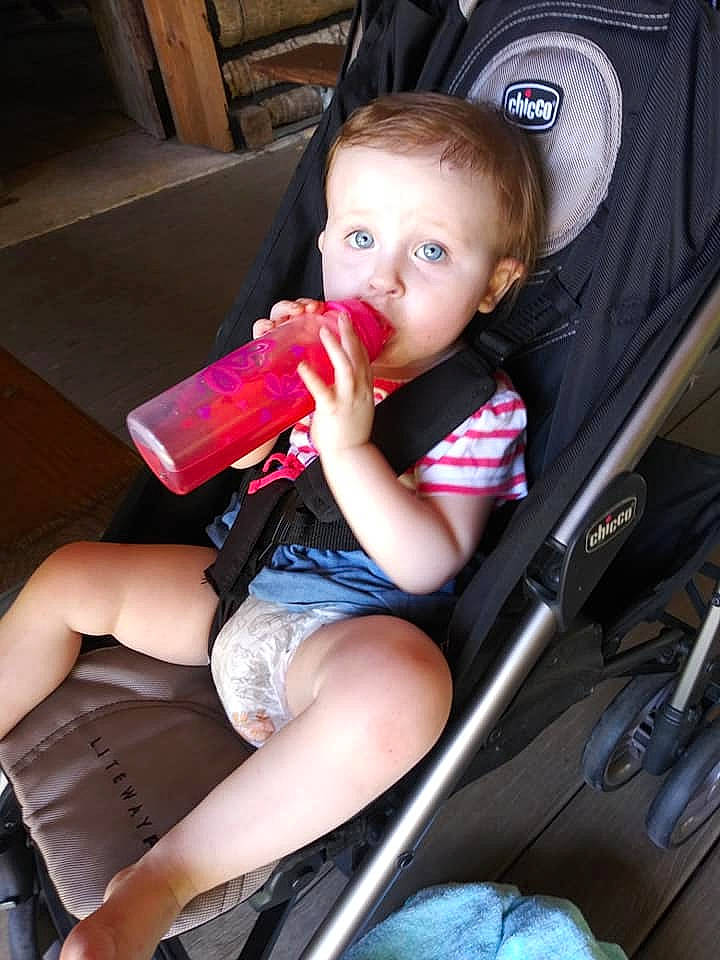 Amber is registered to the contest to win money with this photo: auto_part, baby, baby_carriage, baby_in_car_seat, baby_products, car_seat, child, fun, person, pink, plant, product, sitting, toddler, vacation