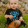 baby, ball, clothing, face, football, grass, head, people, person, photography, plant, portrait, rock, rugby, rugbyball, sitting, soccer, soccerball, sport, t_shirt