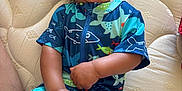 Luca is registered to the contest to win money with this photo: baby, child, smiling, happy, infant, blue_clothing, patterned_clothing, mattress, indoor, cute, face, hand, legs, skin, person, playful, toddler, hair, lying_down, casual