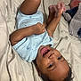 baby, child, smiling, lying_down, onesie, bed, sheet, happy, infant, playful, hands, feet, portrait, cute, indoors, sleepwear, young_child, joyful, skin, face