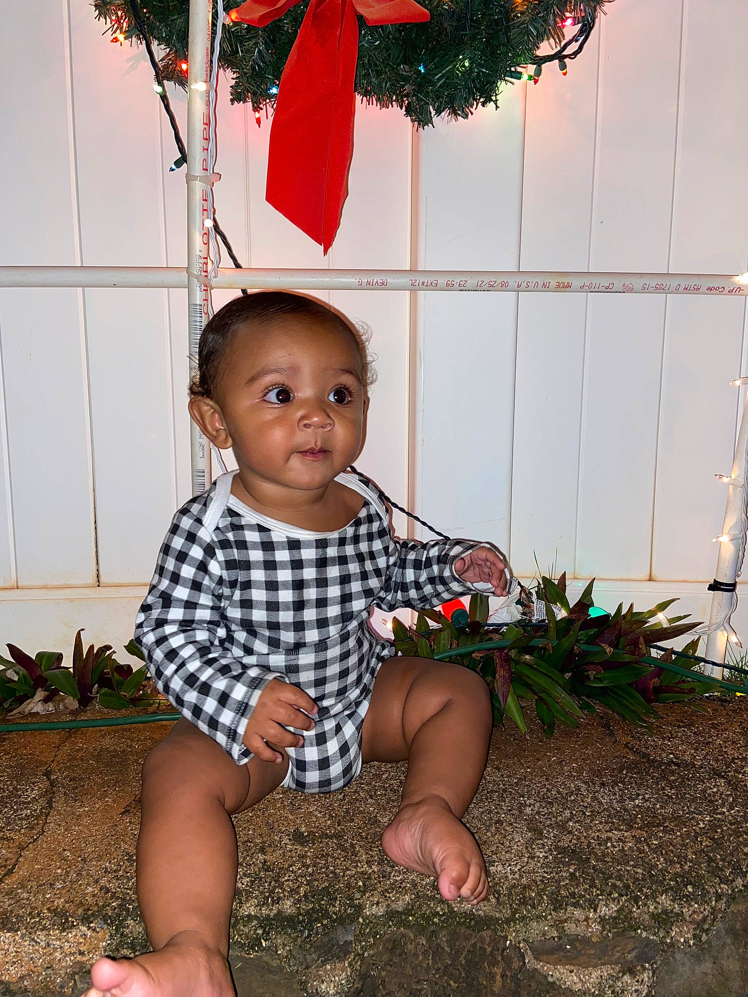 Nohili is registered to the contest to win money with this photo: adaptation, barefoot, child, foot, fun, grass, happy, holiday, leaf, ornament, pattern, people, people_in_nature, person, plant, portrait_photography, red, sitting, soil, t_shirt