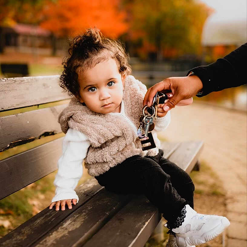 Layonna joined the competition — help win amazing prizes! bodypart, brownhair, child, clothing, curlyhair, face, female, girl, hair, hand, happy, head, jeans, pants, person, photography, sitting, smile