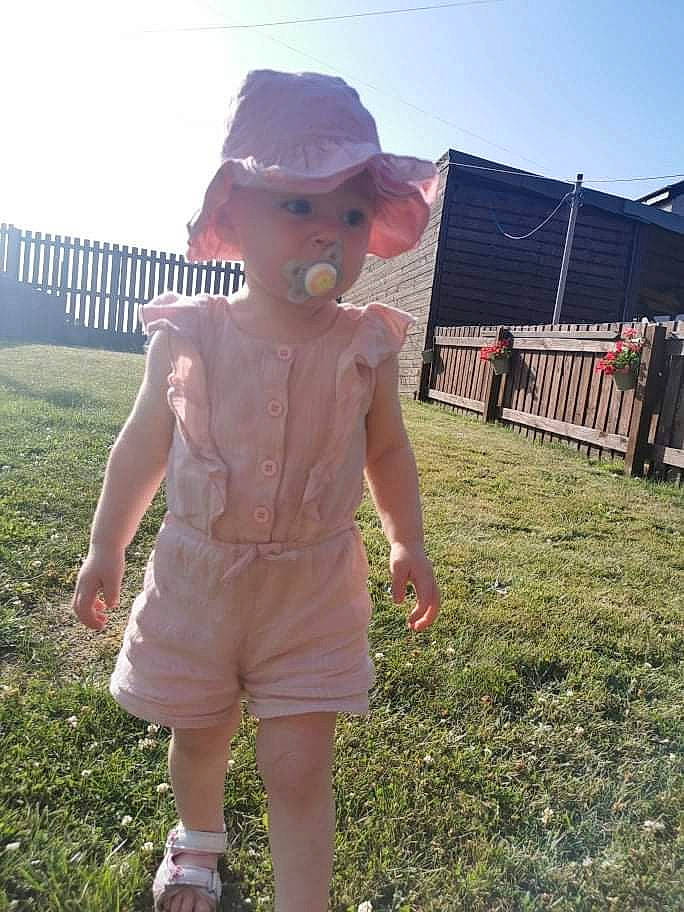 Shaunie joined the competition — help win amazing prizes! art, barechested, cap, child, eyewear, fun, grass, grassland, happy, hat, headwear, landscape, lawn_ornament, leisure, person, pink, sculpture, sky, sun_hat, toy