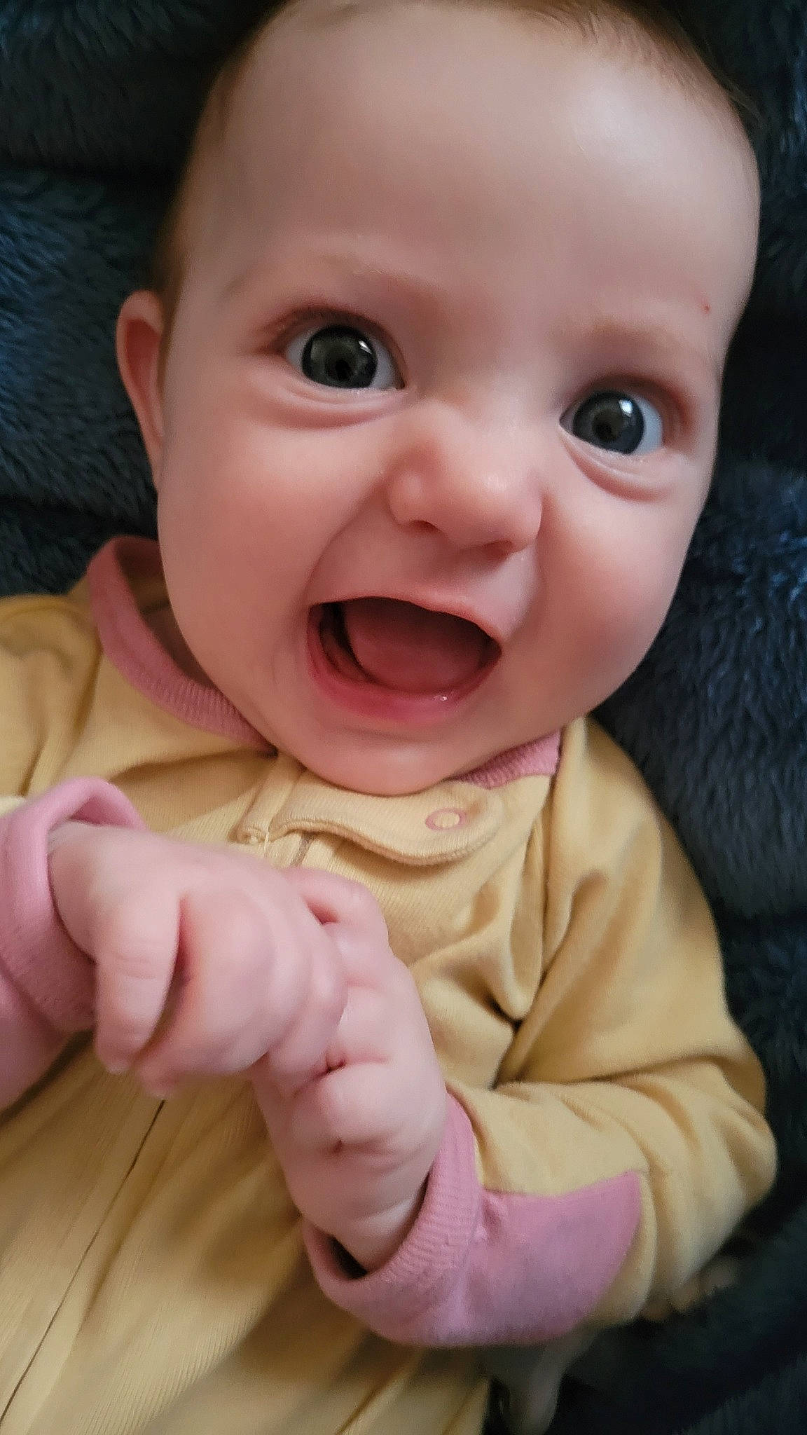 Demi is registered to the contest to win money with this photo: baby, baby_toddler_clothing, cheek, chin, clothing, eye, eyebrow, finger, gesture, happy, iris, lip, mouth, nose, person, pink, product, skin, sleeve, smile