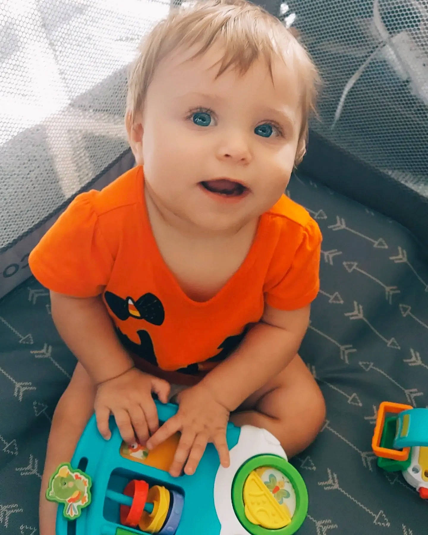 Averiana is registered to the contest to win money with this photo: baby, baby_playing_with_toys, baby_toddler_clothing, cheek, child, finger, flooring, fun, gadget, green, happy, iris, nail, nose, person, photograph, product, snapshot, toddler, toy