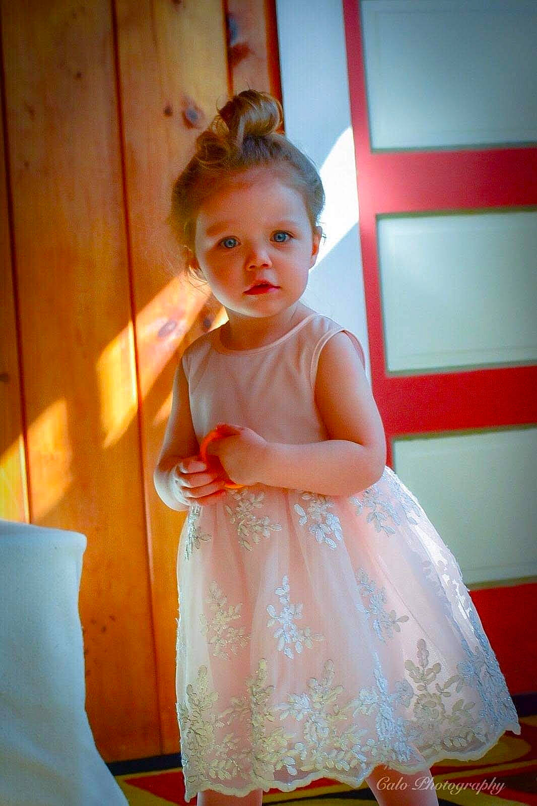 Kinsley is registered to the contest to win money with this photo: child, dress, person, smile, standing, toddler