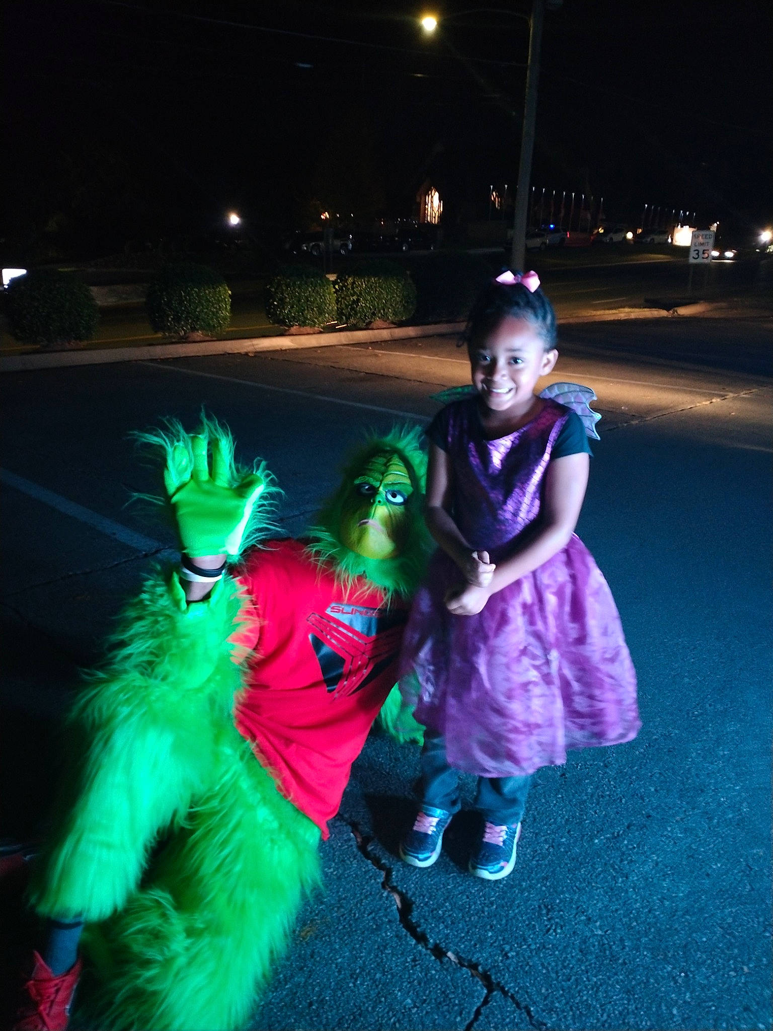 Arielle is registered to the contest to win money with this photo: costume, darkness, electric_blue, entertainment, event, fun, fur, glove, grass, happy, holiday, joy, leisure, magenta, midnight, night, person, purple, recreation, smile