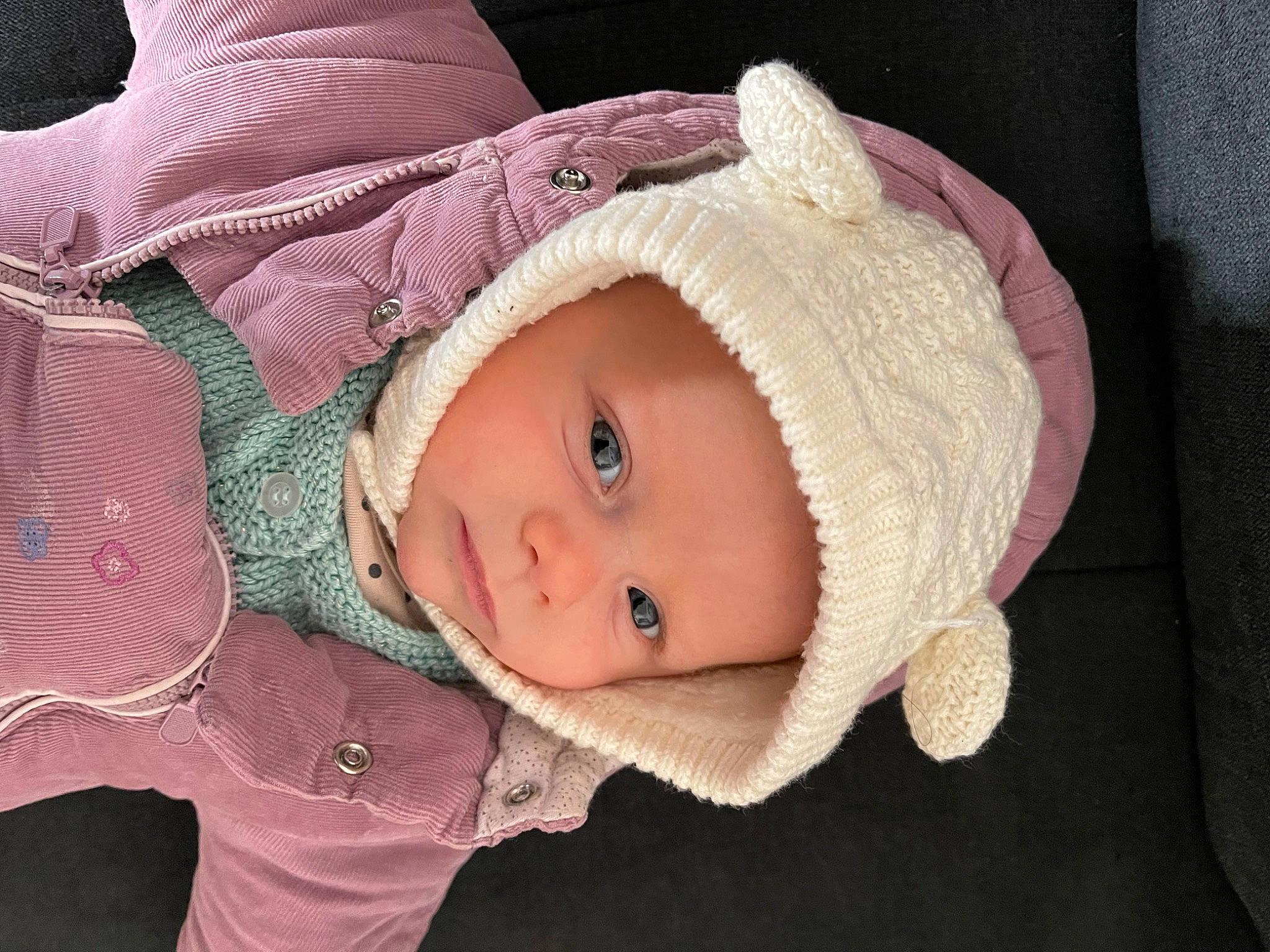Ruby Lee a rejoint le concours — aidez-le/la à gagner de superbes lots ! baby, baby_toddler_clothing, cap, cheek, chin, cool, eye, eyebrow, face, head, headgear, headwear, human_body, iris, jacket, lip, nose, person, pink, skin