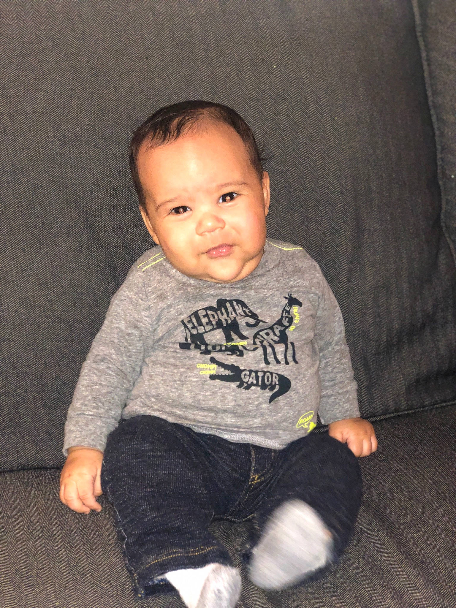 Tristen is registered to the contest to win money with this photo: boy, child, cool, day, eye, fun, girl, infant, mammal, outerwear, person, product, sitting, skin, smile, standing, t_shirt, textile, toddler