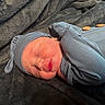 newborn, baby, sleeping, infant, portrait, face, closed_eyes, hat, gray_clothing, swaddled, blanket, cozy, indoors, lying_down, peaceful, cute, close_up, soft_texture, resting, photography