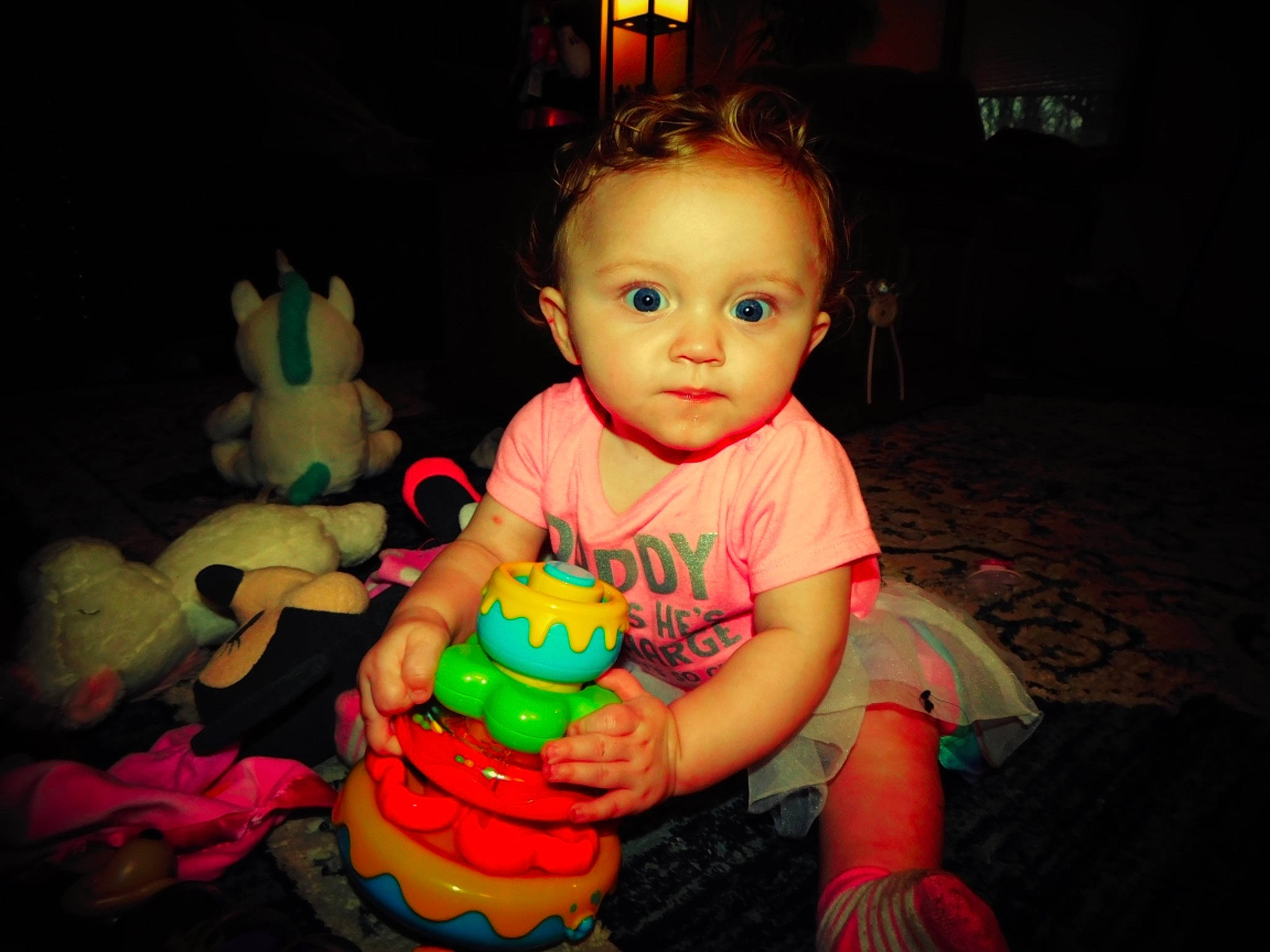 Haylie is registered to the contest to win money with this photo: baby_playing_with_toys, baby_toys, cheek, child, cool, eye, face, finger, fun, head, iris, nose, organ, person, play, product, skin, snapshot, standing, toddler