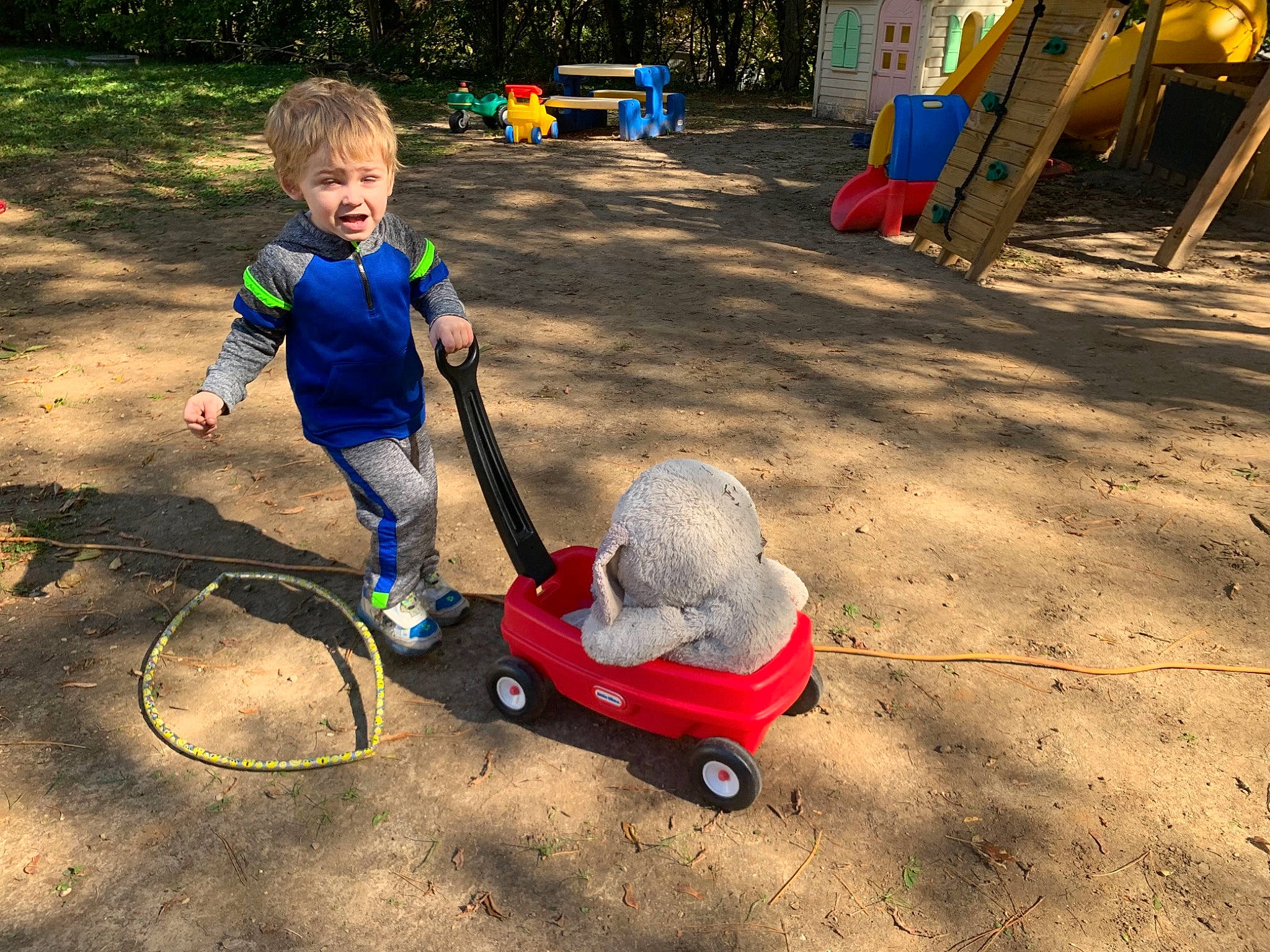 Willie-lee is registered to the contest to win money with this photo: child, fun, garden, grass, lawn, outdoor_play_equipment, person, play, playground, public_space, recreation, sand, soil, toddler, vehicle, yard
