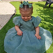 Elaïa a rejoint le concours — aidez-le/la à gagner de superbes lots ! toddler, child, dress, green_dress, bows, pigtails, grass, outdoor, sunlight, shy, smile, baby, cute, garden, shadow, fence, chair, happy, sitting, playful
