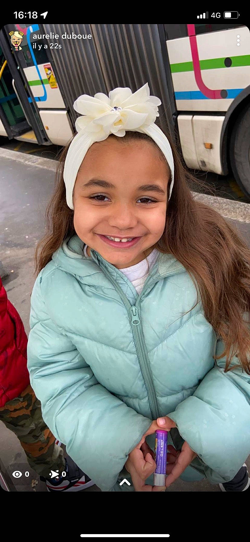 Oriana participe au concours pour gagner de l'argent avec cette photo : automotive_tire, beauty, child, clothing, eye, facial_expression, fun, happy, head, headgear, headwear, iris, jacket, joy, organ, person, pink, skin, smile, tire