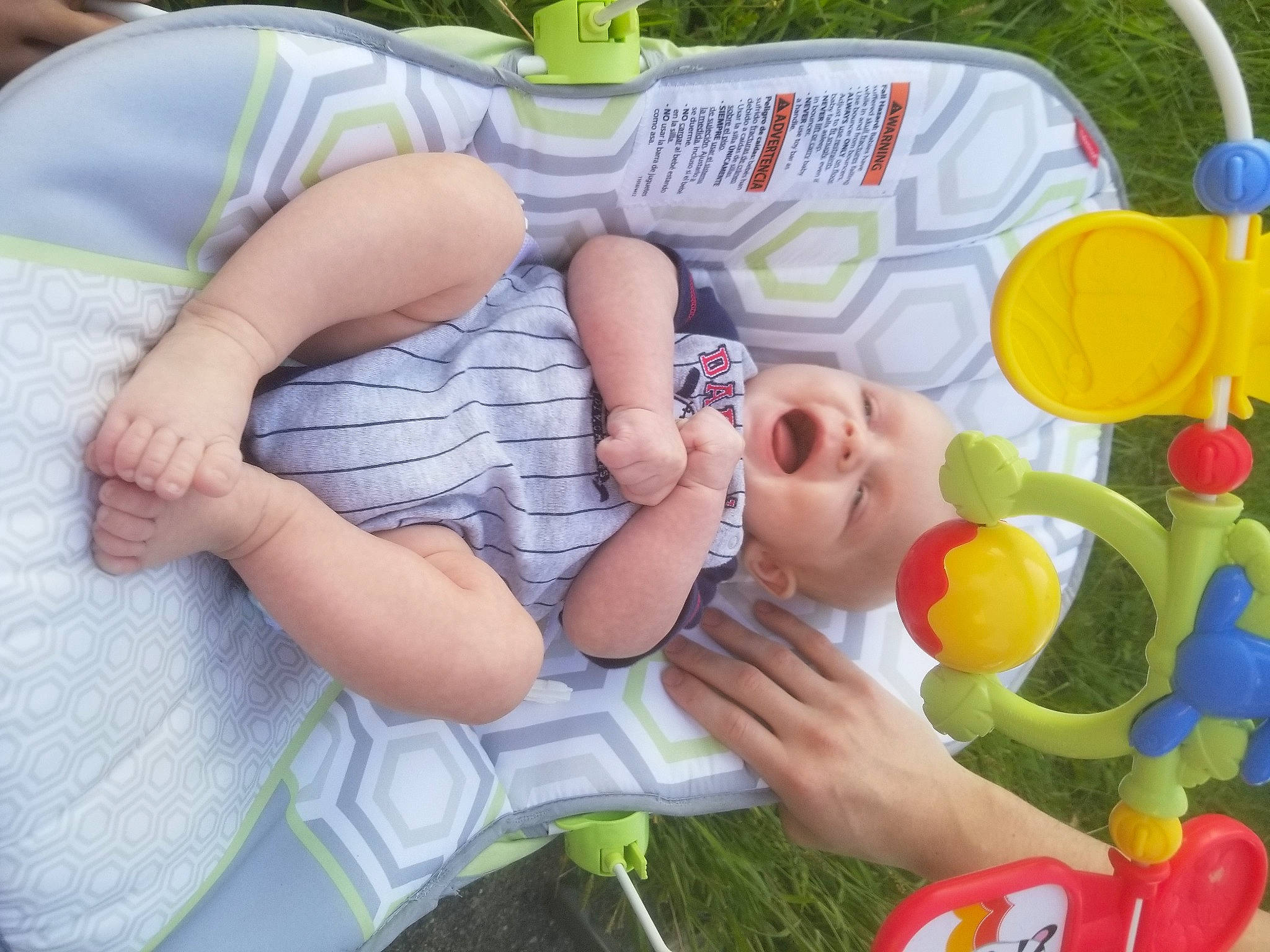 Johnathon is registered to the contest to win money with this photo: baby, baby_playing_with_toys, baby_products, baby_toddler_clothing, baby_toys, child, comfort, finger, fun, grass, happy, leisure, nail, person, play, product, recreation, thumb, toddler, toy