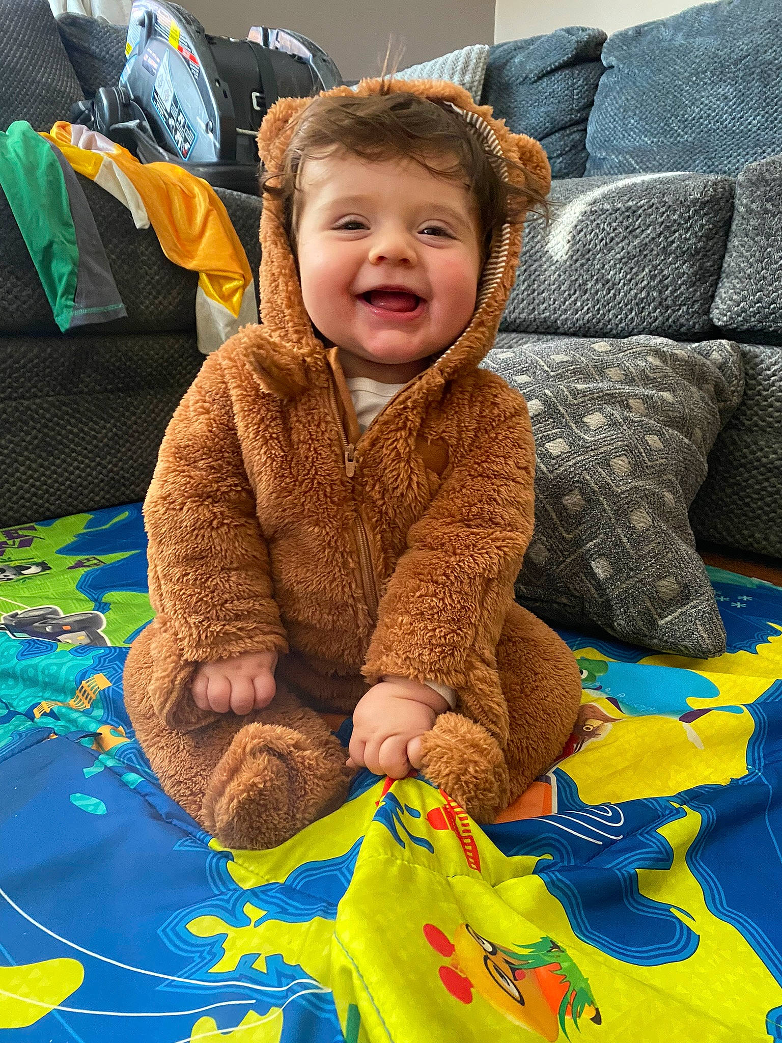 Brycen joined the competition — help win amazing prizes! baby_products, blue, child, comfort, flooring, fun, happy, head, leisure, linens, pattern, people_in_nature, person, play, recreation, sand, sitting, smile, toddler, travel