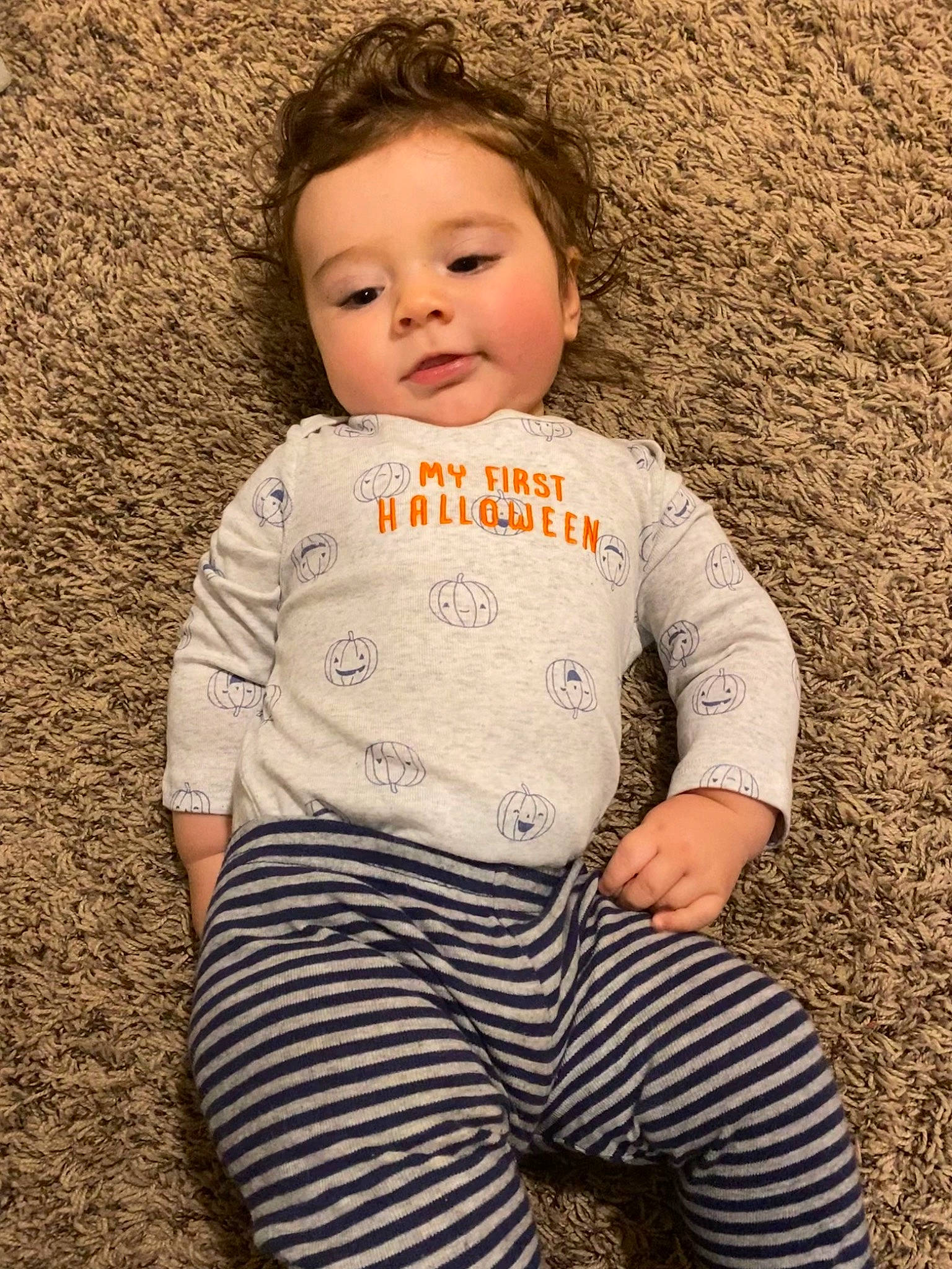 Brycen is registered to the contest to win money with this photo: baby, baby_toddler_clothing, cheek, child, eye, face, fun, grass, happy, head, lip, long_sleeved_t_shirt, nose, pattern, people_in_nature, person, skin, sleeve, t_shirt, toddler